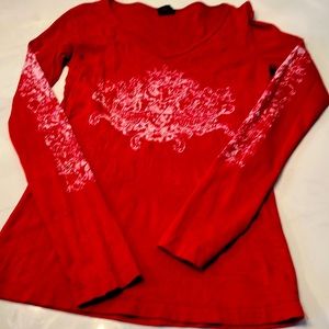 Red casual shirt with white crest